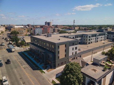 an aerial view of a large building in a city at The Landing at 1001 NP, Fargo, ND 58102