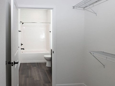 a bathroom with a toilet and a bathtub at The Landing at 1001 NP, Fargo, ND, 58102