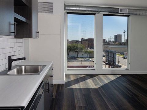 a kitchen with a sink and a window at The Landing at 1001 NP, Fargo, North Dakota, 58102