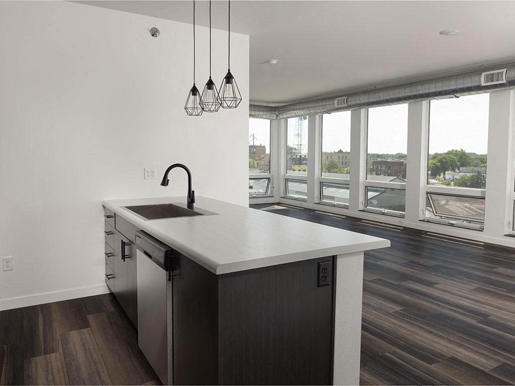 a kitchen with a large window and a sink at The Landing at 1001 NP, Fargo, ND 58102