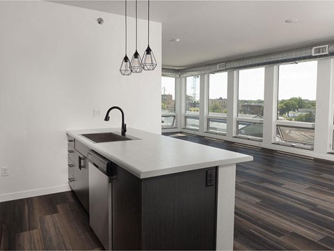 a kitchen with a large window and a sink at The Landing at 1001 NP, Fargo, ND 58102