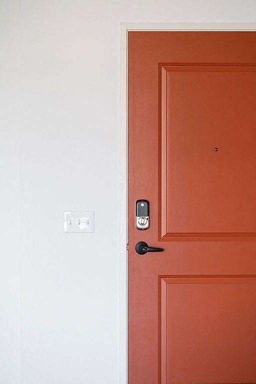a red door with a white door next to it at The Landing at 1001 NP, Fargo, North Dakota 58102