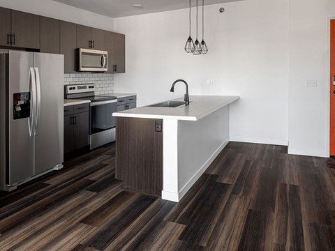 a kitchen with a large island and stainless steel appliances Landing at 1001 NP, Fargo, ND, 58102