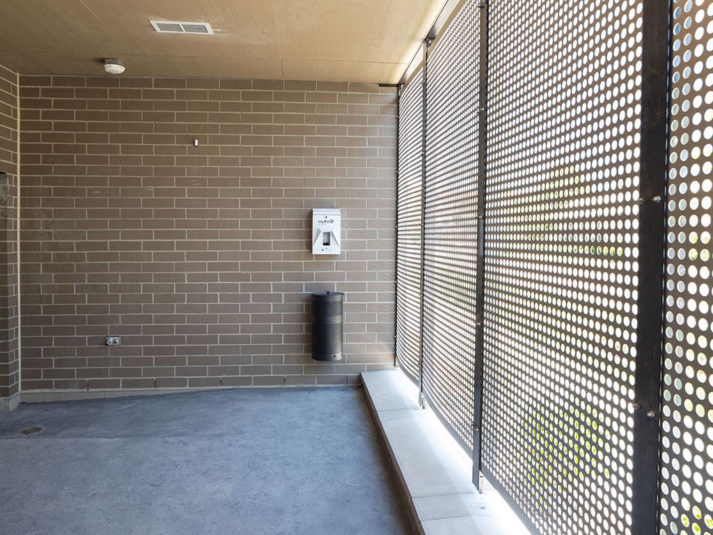a hallway with a privacy screen and a trash can at The Landing at 1001 NP, Fargo, North Dakota 58102