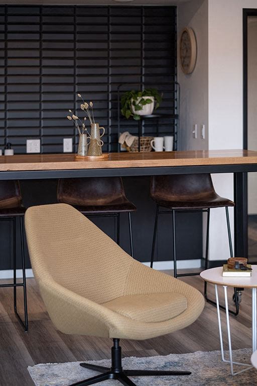 a chair is sitting in front of a table at The Landing at 1001 NP, Fargo, ND 58102