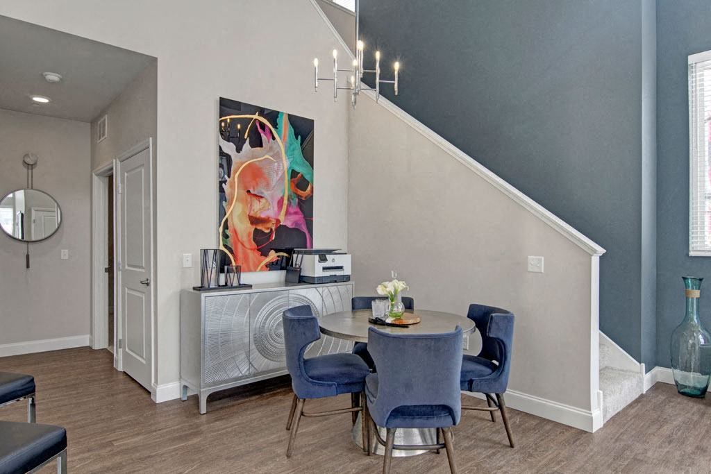 a dining room with a table and chairs
