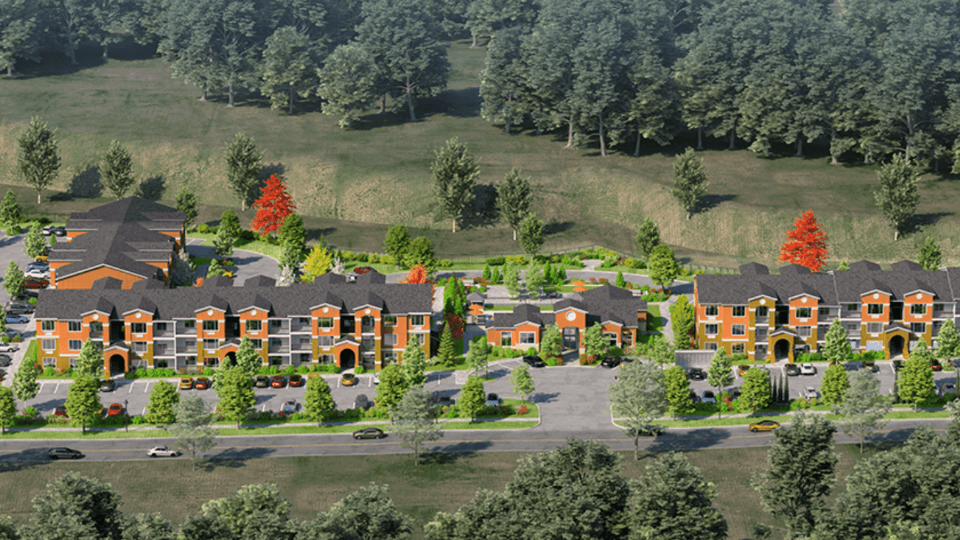 an aerial view of a subdivision with houses and trees