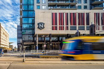 a train passes in front of a building