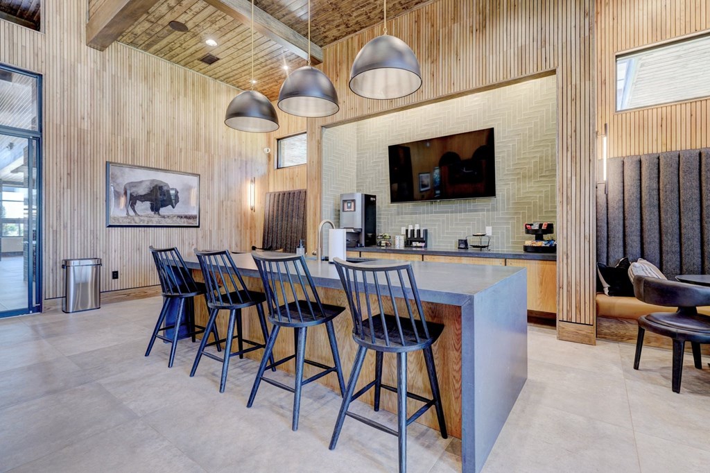 clubhouse kitchen with an island and chairs