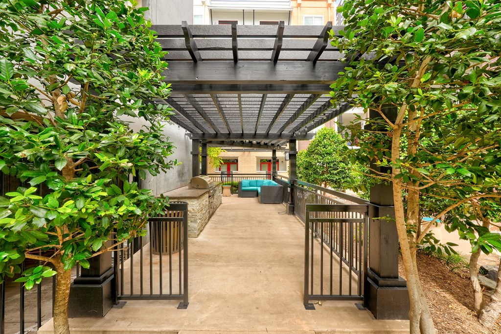a view of a corridor with trees and a staircase