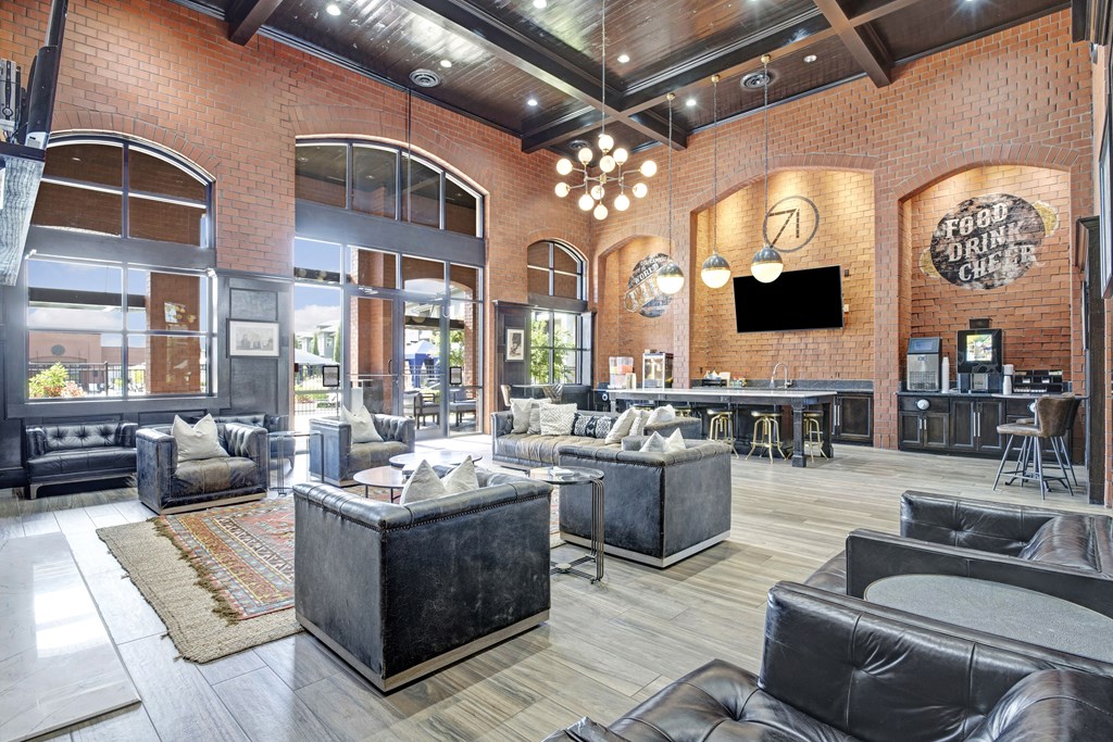 a living room with couches and chairs and a tv