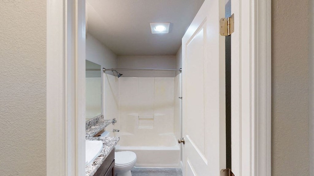 a bathroom with a toilet and a sink