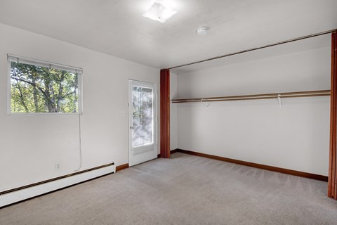 Empty room with a window and a door.