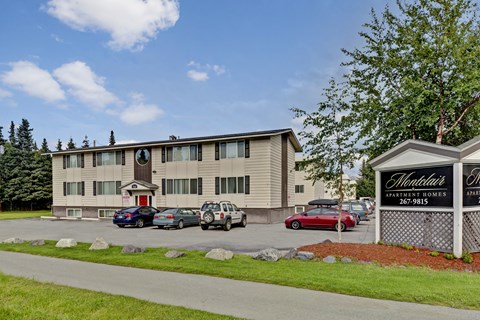 A building with a sign that says Heartland Apartment Homes.