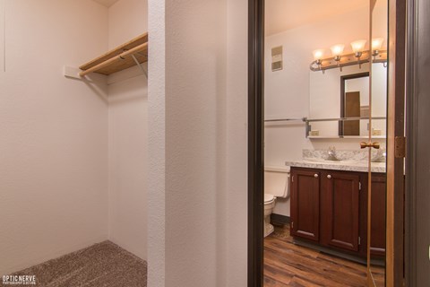 A bathroom with a towel rack and a mirror.