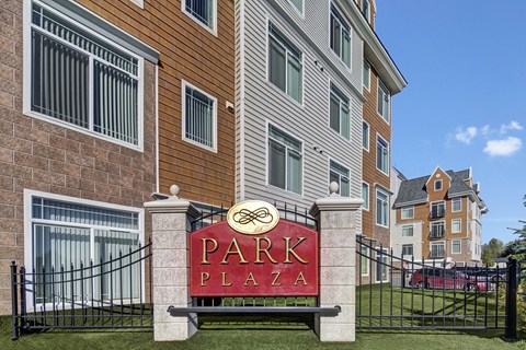 A sign that says Park Plaza in front of a building.