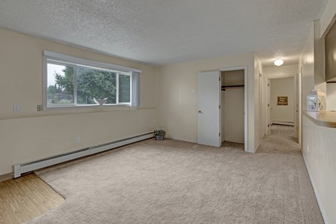 A room with a window and a door.