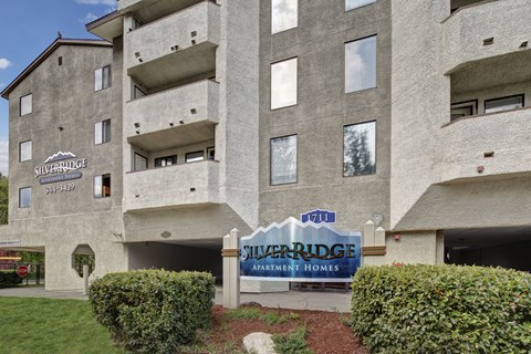 Apartment complex with a sign that says Silverridge Apartments Homes.