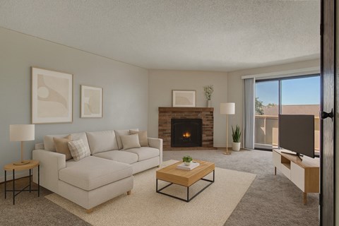 A living room with a fireplace and a couch.