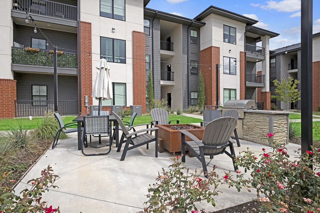 our apartments have a patio with chairs and tables