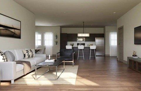 A modern living room with a white sofa and a glass coffee table.