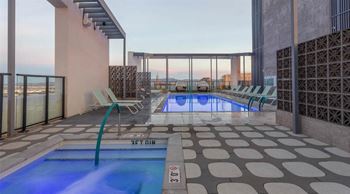 a swimming pool with a view of a city