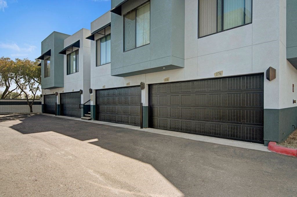 Acclaim Apartments- Garage and parking area 