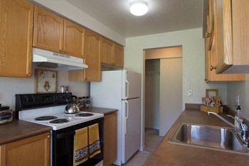 A kitchen with Lots of counter space and cabinet storage with easy access to the dining area Andorra Kitchen - Photo Gallery 4