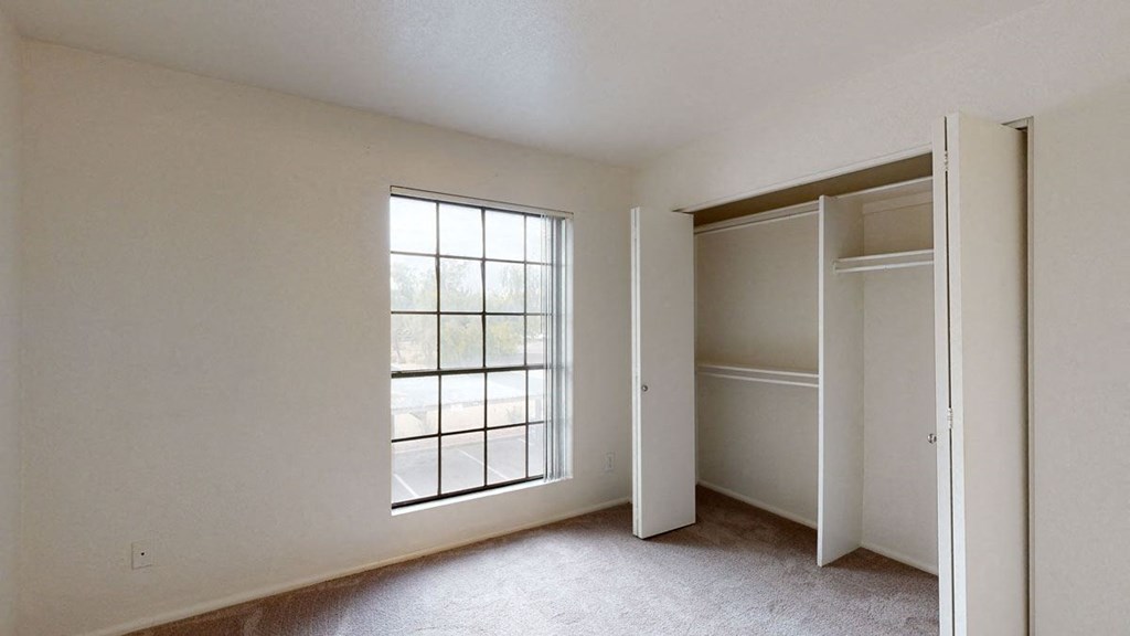 Bedroom 2 with window and closet