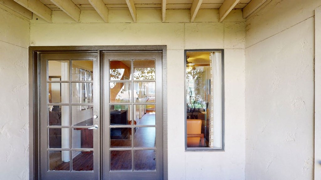 a house with two doors and two windows
