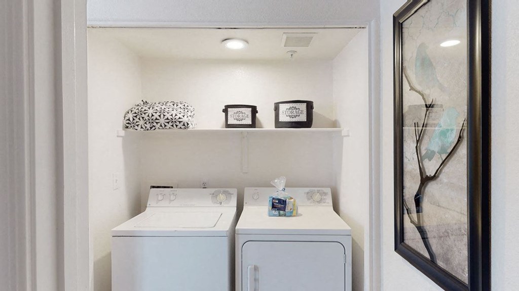 a white washer and dryer in a room