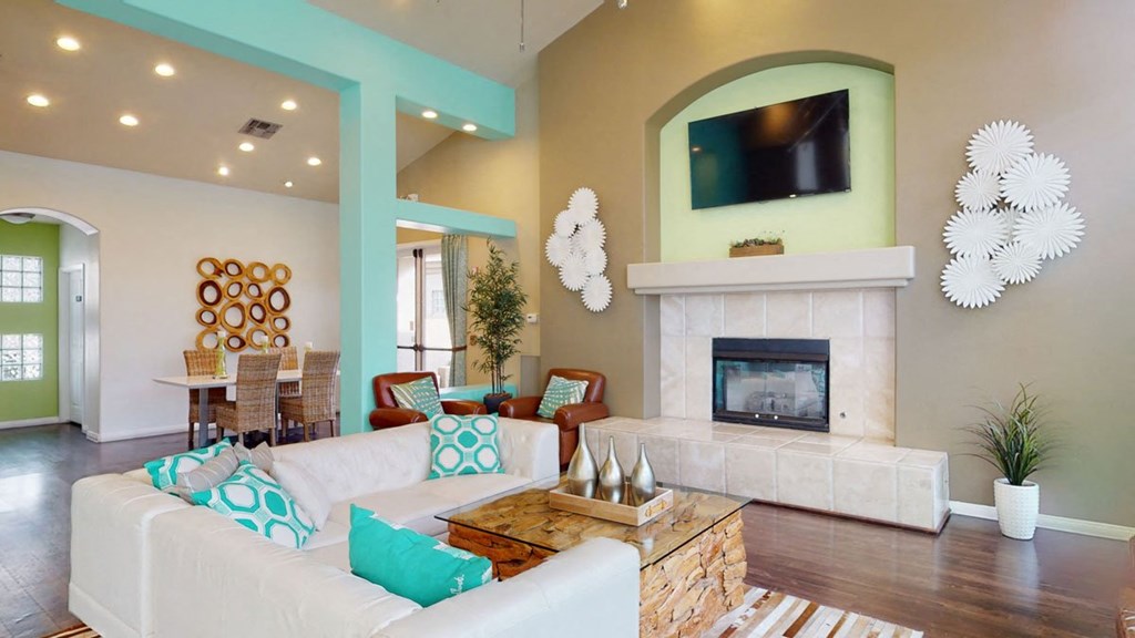 a living room with a fireplace and a flat screen tv