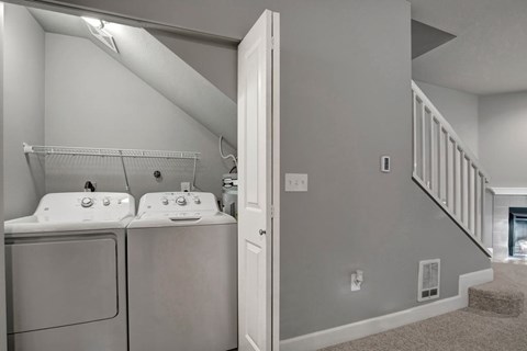 A laundry room with a washer and dryer.