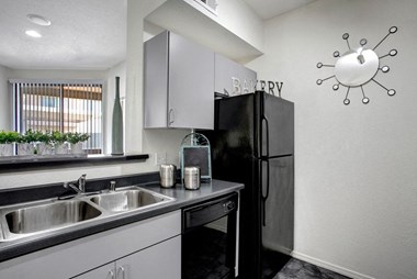 Bolero Apartments Kitchen with black appliances