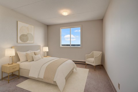 A bedroom with a large bed and a chair by the window.