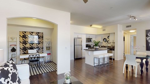A modern kitchen with a dining table and chairs.