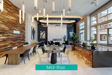 A modern dining room with a wooden table and chairs.