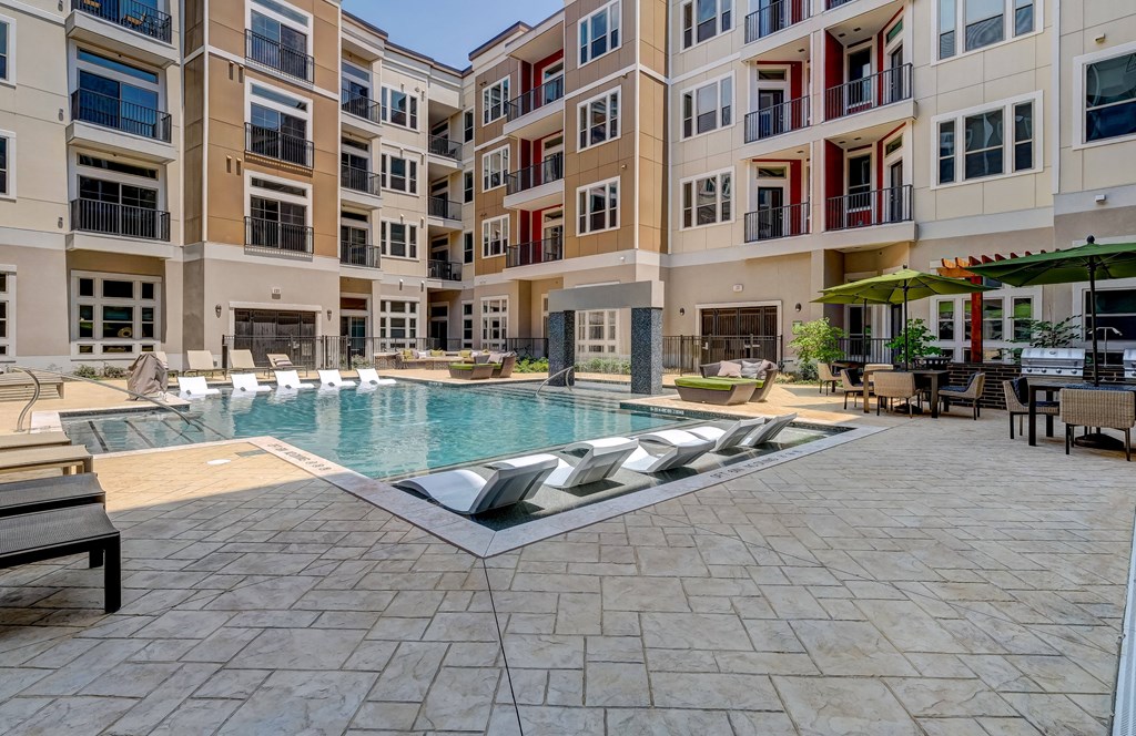 a swimming pool in the middle of an apartment building