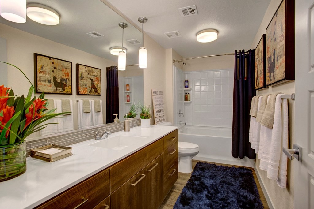 a bathroom with a toilet sink and bathtub