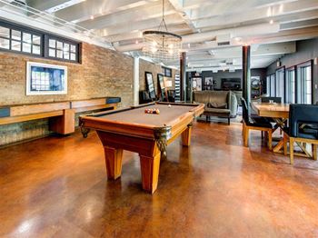 Elegant clubhouse with billiards and shuffleboard table