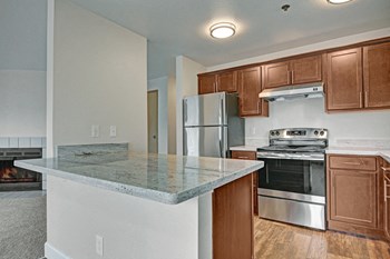 Kitchen with stainless steel appliances, ample counter space and lots of cabinet storage Foster Greens Kitchen - Photo Gallery 2