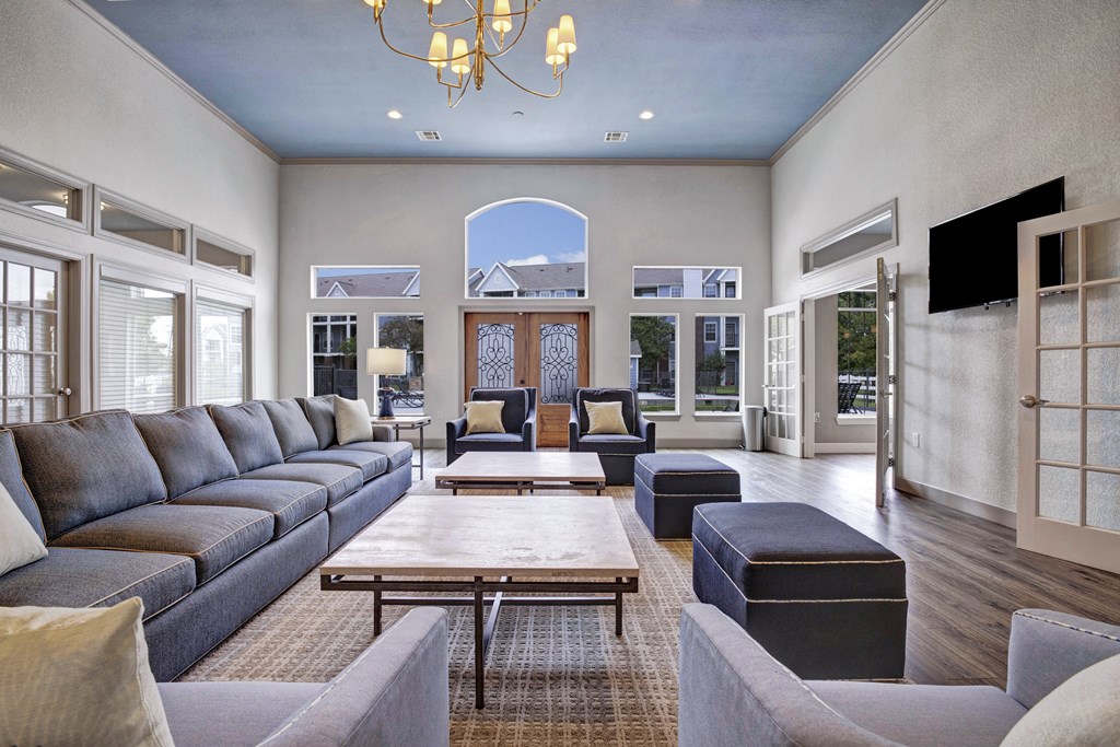 Resident lounge with couches and chairs and a table Apartments for rent Springdale AR