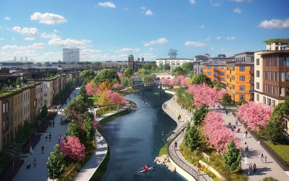 A picturesque urban scene near The Collection at Highland Bridge Apartment Homes with a winding river flanked by cherry blossom trees and modern buildings. People stroll and kayak under a sunny sky, creating a lively, serene atmosphere.