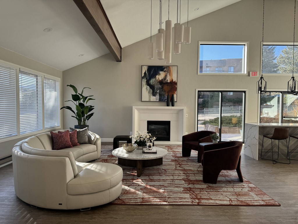 Lounge with couches and chairs and a fireplace
