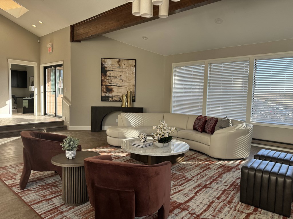 Lounge room with a white couch and chairs