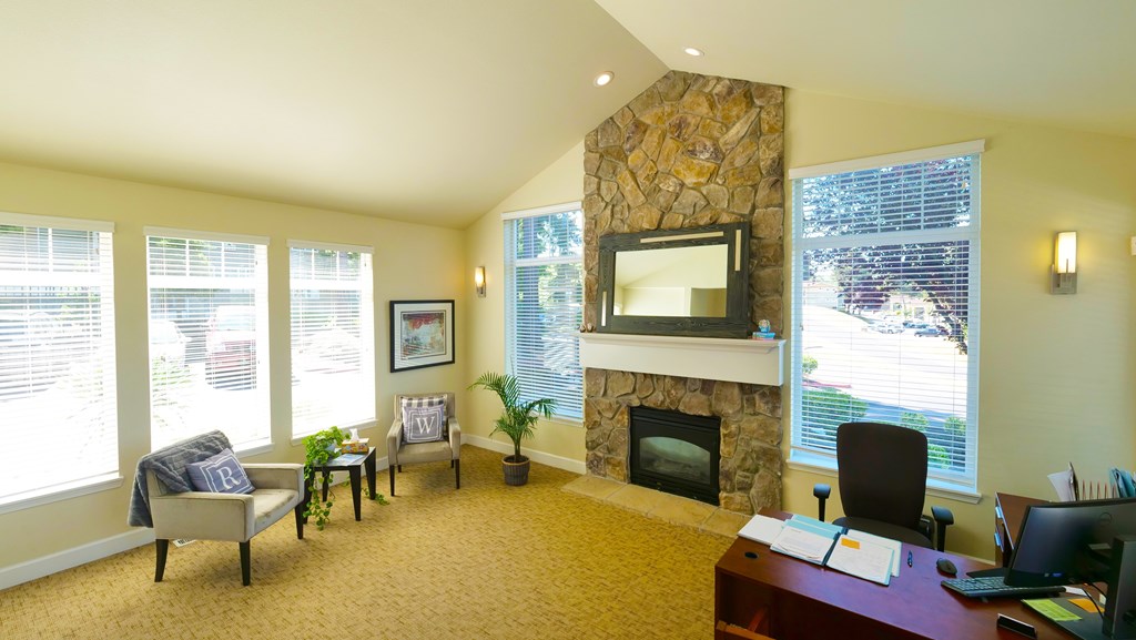 A living room with a fireplace and a television.