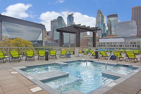 A pool with a view of the city skyline.