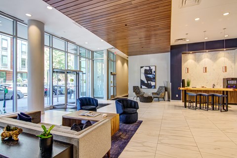 A spacious and upscale main lobby and coffee bar lounge area inside the LPM Apartments in Minneapolis.