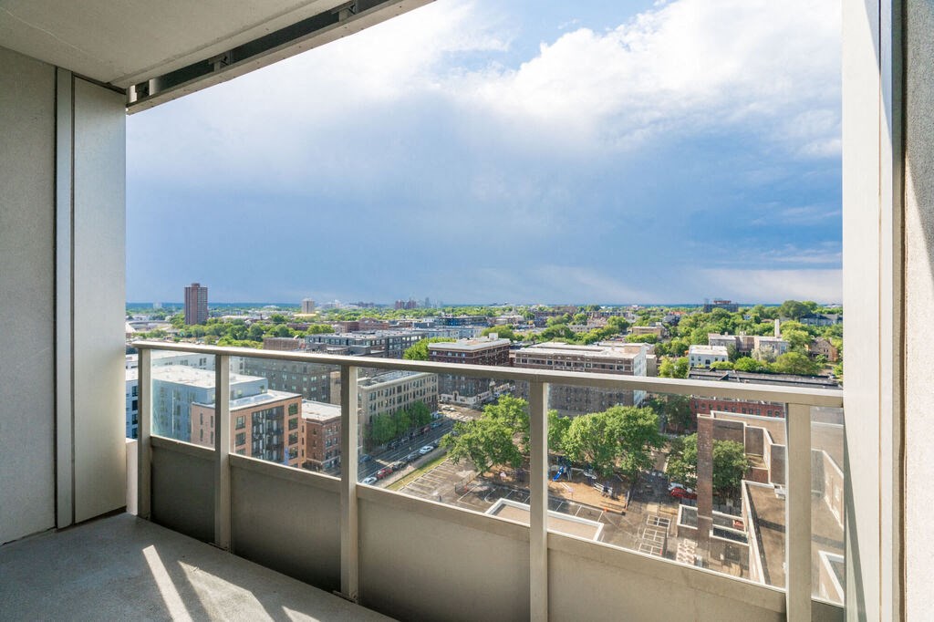 a balcony with a view of a city