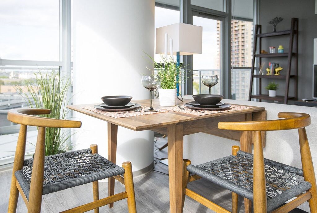 a dining room with a table and chairs